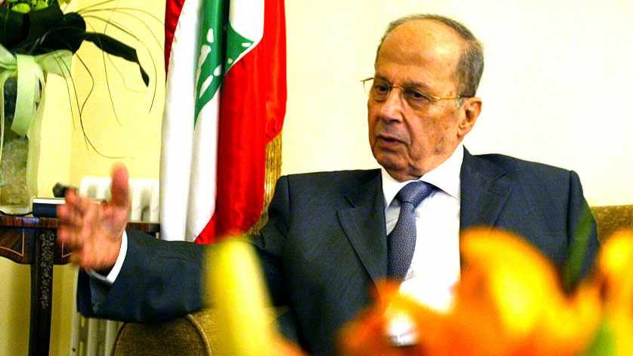 Lebanon's anti-Syrian Christian Leader Michel Aoun speaks during an interview with Reuters in his house near Beirut.  Lebanon's anti-Syrian Christian Leader Michel Aoun speaks during an interview with Reuters in his house near Beirut May 11,2005. Former general Michel Aoun, a leading opponent of Syria influence, said on Wednesday he was willing to join forces with allies of Damascus,including Hizbollah, to contest elections starting this month. REUTERS/Jamal Saidi - RTRAU5B