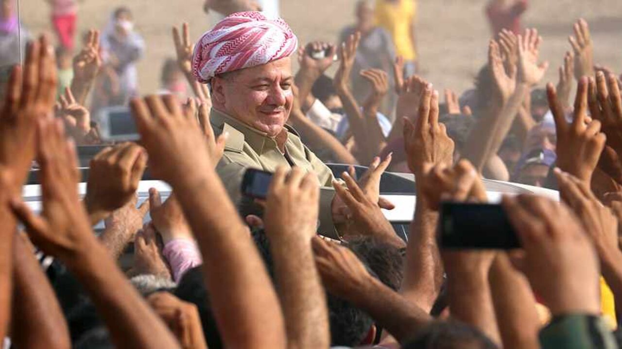 SYRIA-CRISIS/REFUGEES Iraqi Kurdish President Massoud Barzani (C) visits Syrian refugees at the Quru Gusik refugee camp in Arbil, about 350 km (220 miles) north of Baghdad, August 19, 2013. An estimated 29,000 Syrian refugees have entered northern Iraq since Thursday in one of the largest crossings in Syria's two-year-old conflict and the influx is continuing, the United Nations said on Monday. REUTERS/Stringer (IRAQ - Tags: SOCIETY IMMIGRATION) - RTX12R1S