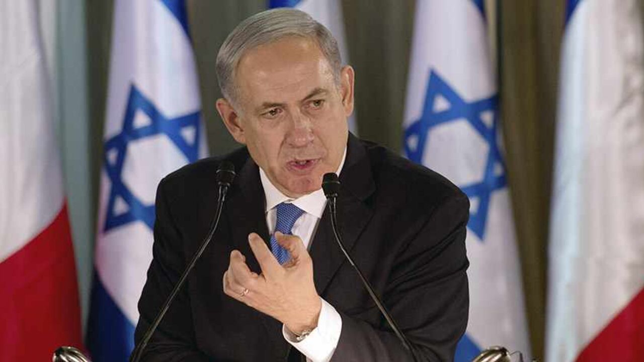 Israel Prime Minister Benjamin Netanyahu speaks during a joint news conference with French President Francois Hollande (not pictured) at his residence in Jerusalem November 17, 2013.  President Hollande assured Israel on Sunday that France would continue to oppose an easing of economic sanctions against Iran until it was convinced Tehran had ended a pursuit of nuclear weapons. REUTERS/Alain Jocard/Pool (JERUSALEM - Tags: POLITICS) - RTX15HKF