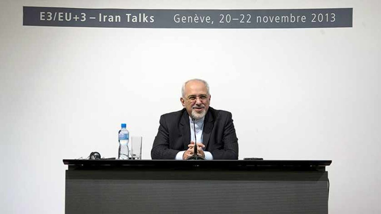 IRAN-NUCLEAR/ Iranian Foreign Minister Mohammad Javad Zarif speaks to the media about the deal that has been reached between six world powers and Iran at the International Conference Centre of Geneva in Geneva November 24, 2013. Iran and six world powers reached a breakthrough deal early on Sunday to curb Tehran's nuclear programme in exchange for limited sanctions relief, in what could be the first sign of an emerging rapprochement between the Islamic state and the West. REUTERS/Carolyn Kaster/Pool (SWITZERLAND