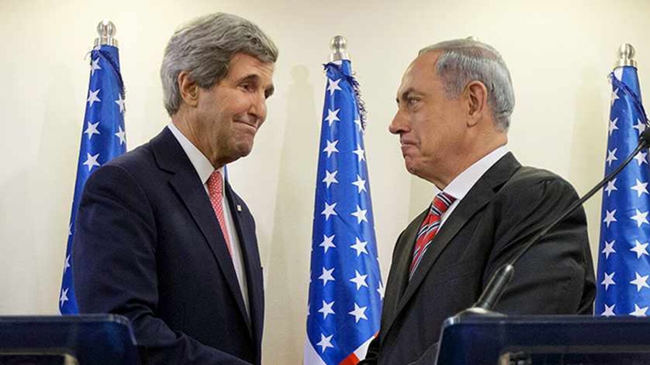 PALESTINIANS-ISRAEL/USA U.S. Secretary of State John Kerry (L) shakes hands with Israeli Prime Minister Benjamin Netanyahu after a joint news conference at the Prime Minister's Office in Jerusalem, December 5, 2013. Kerry said on Thursday that some progress had been made in Israeli-Palestinian peace talks and that he had presented Israel with ideas for improving its security under any future accord. REUTERS/Pablo Martinez Monsivais/Pool (JERUSALEM - Tags: POLITICS) - RTX164LE