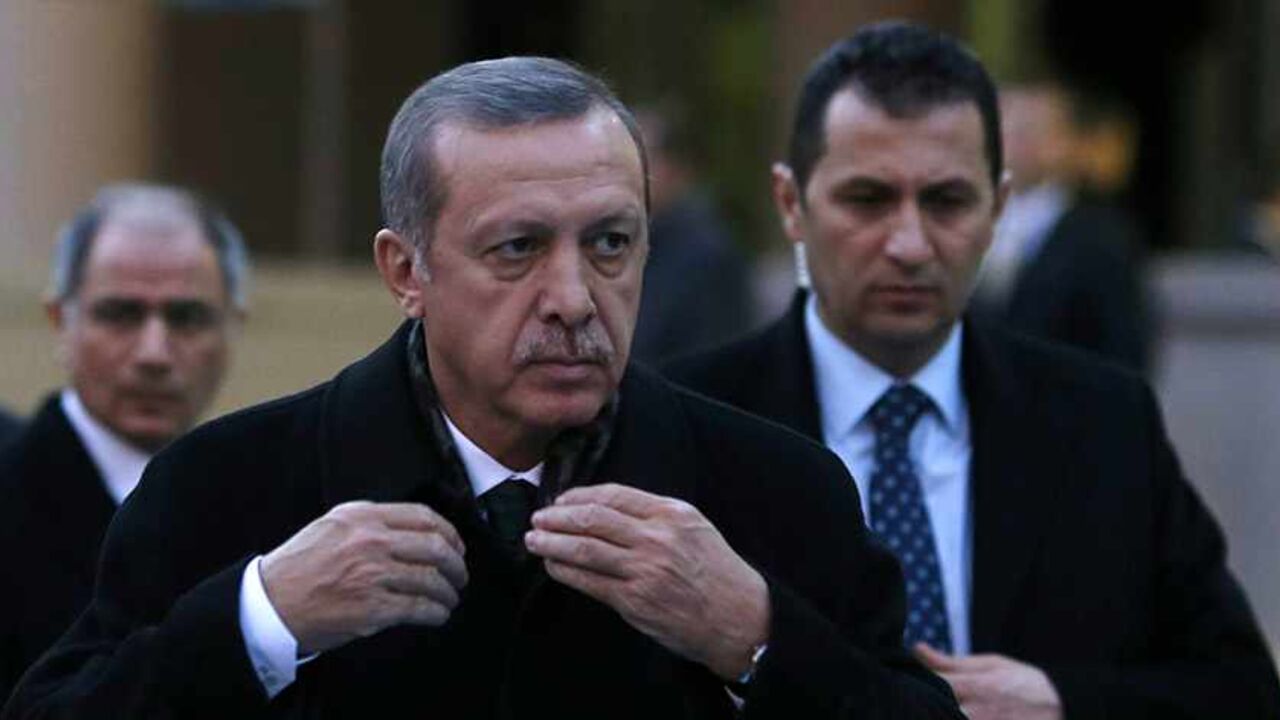 TURKEY-CORRUPTION/ Turkey's Prime Minister Tayyip Erdogan arrives for a ceremony in Ankara December 18, 2013. Scores of people including three ministers' sons, prominent businessmen close to Erdogan and local government officials were detained on Tuesday in the biggest corruption investigation since he swept to power in 2002. REUTERS/Umit Bektas (TURKEY - Tags: POLITICS) - RTX16NF0