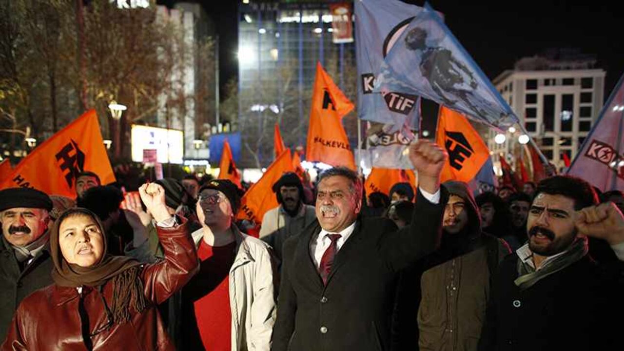 TURKEY-CORRUPTION/ Protesters demonstrate against Turkey's ruling Ak Party (AKP) government and demand that Prime Minister Tayyip Erdogan's resign because of the corruption investigation in Ankara December 18, 2013. Turkish Deputy Prime Minister Bulent Arinc said on Wednesday a corruption investigation in which 52 people including the sons of three cabinet ministers have been detained was part of a "planned operation" to tarnish the government. In the first official comments on the investigation from a senior member of the go