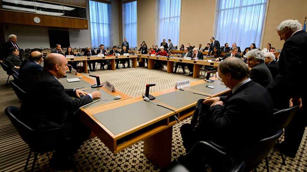 SYRIA-CONFLICT/ Delegates are pictured prior to a meeting on Syria at the United Nations offices in Geneva December 20, 2013. REUTERS/Fabrice Coffrini/Pool (SWITZERLAND - Tags: POLITICS) - RTX16PNF