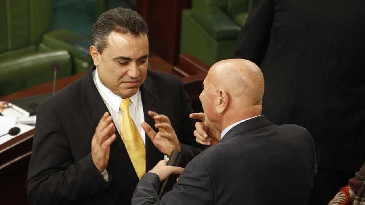 Tunisia's prime minister-designate Mehdi Jomaa (L) speaks with Nejib Chebbi, leader of the Al Joumhouri party, in the constituent assembly in Tunis December 25, 2013. REUTERS/Zoubeir Souissi (TUNISIA - Tags: POLITICS) - RTX16TSI