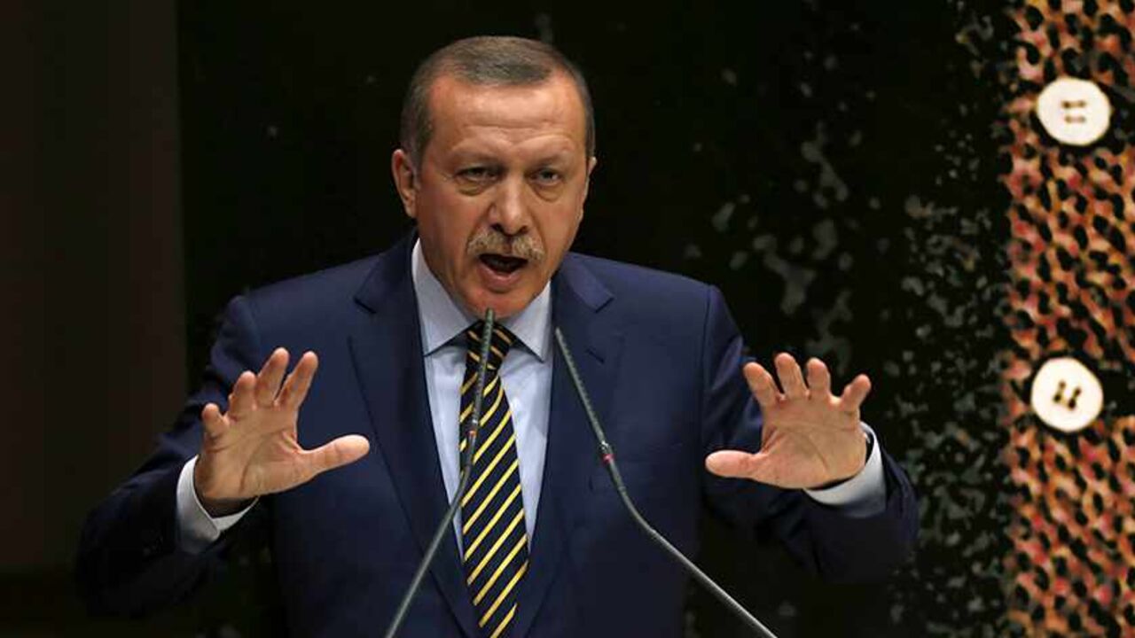 TURKEY-CORRUPTION/ERDOGAN Turkey's Prime Minister Tayyip Erdogan addresses members of his ruling AK Party (AKP), during a meeting at party headquarters in Ankara December 25, 2013. Erdogan said his ruling AK Party will not tolerate corruption on Wednesday after three cabinet members resigned over a high-level graft probe. REUTERS/Umit Bektas (TURKEY - Tags: POLITICS) - RTX16TTF
