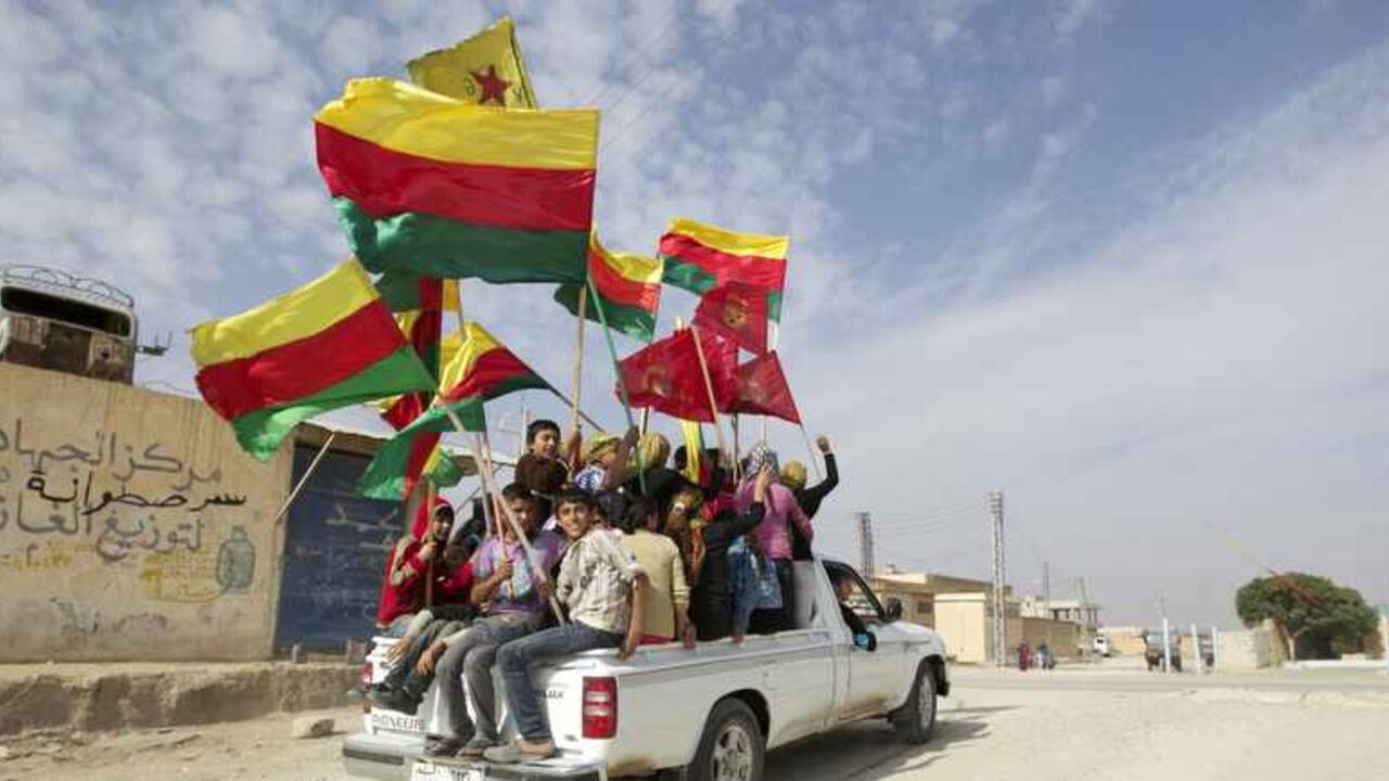 People sit in the back of a truck as they celebrate what they said was the liberation of villages from Islamist rebels near the city of Ras al-Ain People sit in the back of a truck as they celebrate what they said was the liberation of villages from Islamist rebels near the city of Ras al-Ain in the province of Hasakah, after capturing it from Islamist rebels November 6, 2013. Redur Xelil, spokesman for the armed wing of the Syrian Kurdish Democratic Union Party (PYD), said Kurdish militias had seized the city of Ras al-Ain and all its surrounding villages. Syrian Kurdish fighters have captured more territory from Islamist rebels in northeastern Syria