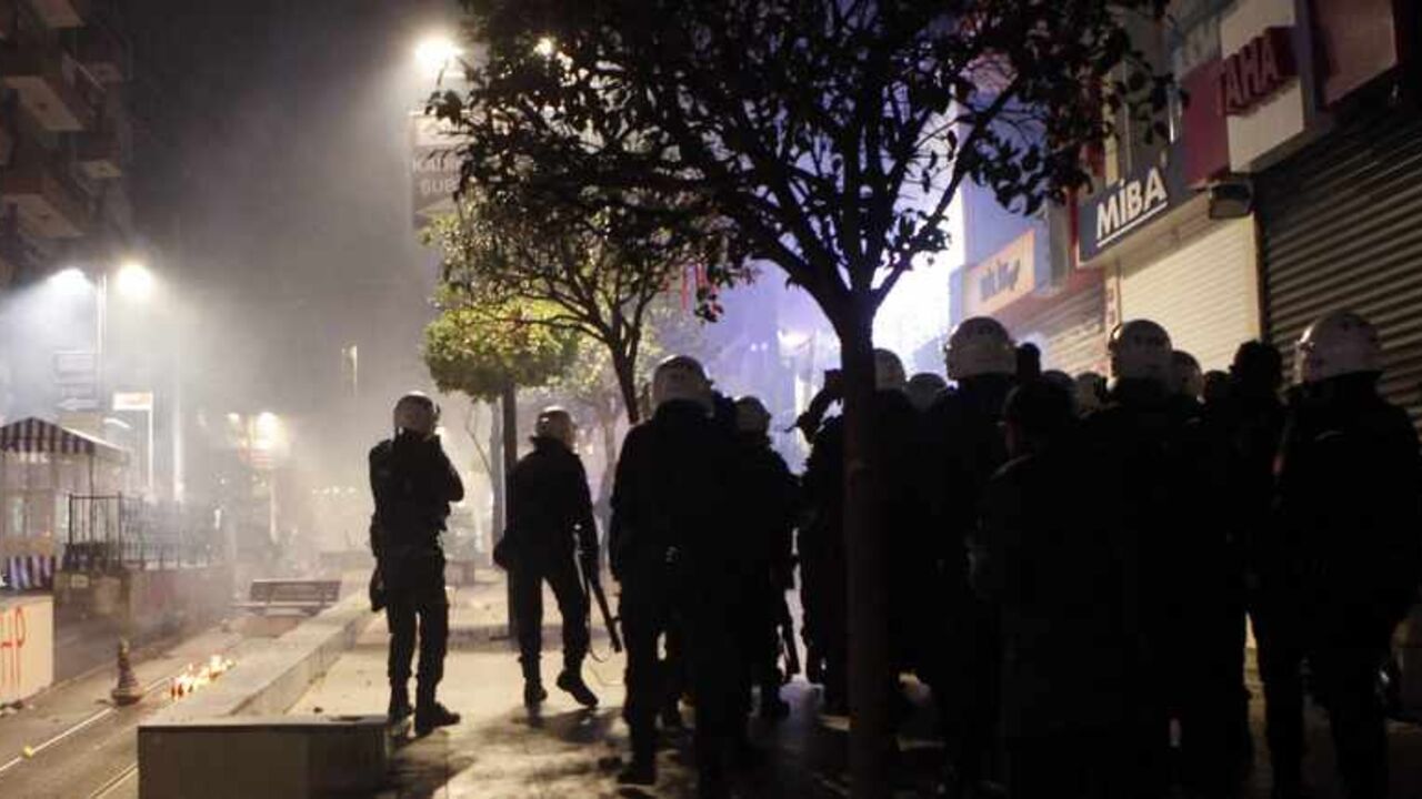 Riot police fire teargas during a protest against Turkey's ruling Ak Party (AKP) and Prime Minister Tayyip Erdogan Riot police fire teargas during a protest against Turkey's ruling Ak Party (AKP) and Prime Minister Tayyip Erdogan in Istanbul December 25, 2013. Turkey's Prime Minister Tayyip Erdogan presented a new list of cabinet ministers to President Abdullah Gul on Wednesday after three ministers resigned over a high-level graft inquiry, sources said. It was unclear if more than the resigned ministers had been replaced. Erdogan is expected to make a statement later amid the spiralling corruption scandal. REUTERS/Osma