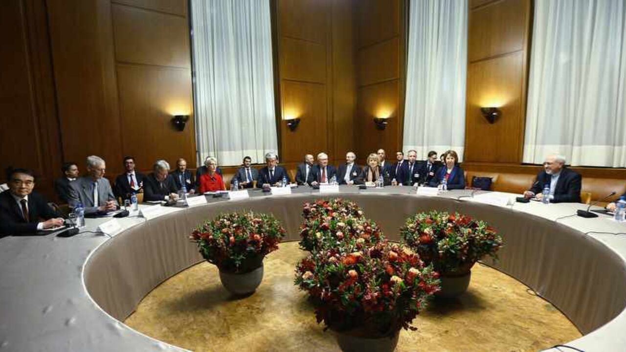 EU foreign policy chief Ashton speaks with Iranian Foreign Minister Zarif during photo opportunity before start of two days of closed-door nuclear talks at the United Nations European headquarters in Geneva European Union foreign policy chief Catherine Ashton (2nd R) speaks with Iranian Foreign Minister Mohammad Javad Zarif (R) during a photo opportunity before the start of two days of closed-door nuclear talks at the United Nations European headquarters in Geneva November 20, 2013. REUTERS/Denis Balibouse (SWITZERLAND - Tags: POLITICS) - RTX15LX0