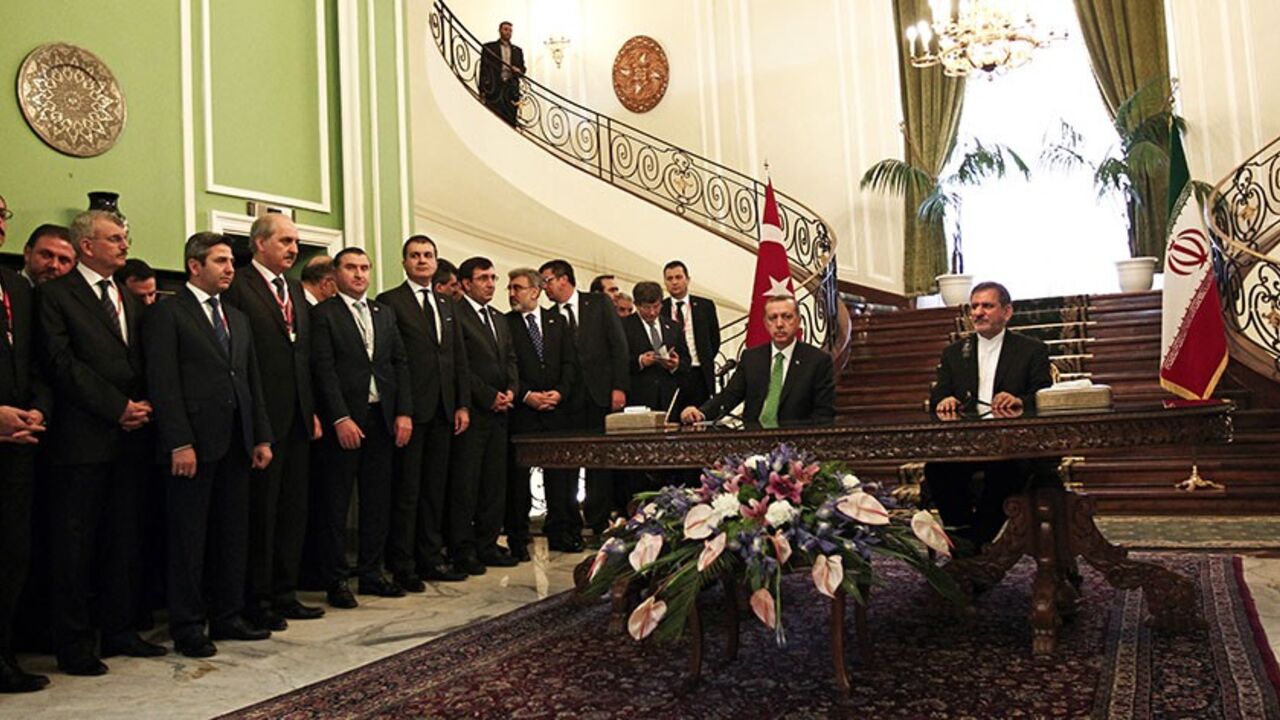 Nic6290383 The Turkish delegation stand as Turkish Prime Minister Recep Tayyip Erdogan (C-L) and Iran's First Vice President Eshaq Jahangiri (R) speak to the media at Tehran's Saadabad palace on January 29, 2014. Erdogan's visit comes as the two countries are trying to rebuild relations strained by the situation in Syria, with Iran supporting President Bashar al-Assad while Turkey backs the rebels seeking to oust him. AFP PHOTO/BEHROUZ MEHRI (Photo credit should read BEHROUZ MEHRI/AFP/Getty Images)