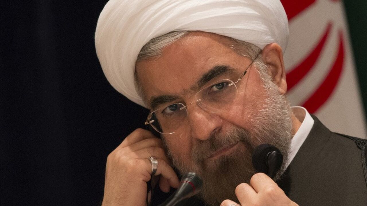 Iran's President Hassan Rouhani takes questions from journalists during a news conference in New York Iran's President Hassan Rouhani takes questions from journalists during a news conference in New York September 27, 2013. New Iranian President Rouhani said on Friday he wanted talks with major powers on Iran's nuclear program to yield results in a short period of time and that the improved mood in U.S.-Iranian relations could lead to better ties. REUTERS/Adrees Latif (UNITED STATES - Tags: POLITICS ENERGY) - RTX142CR