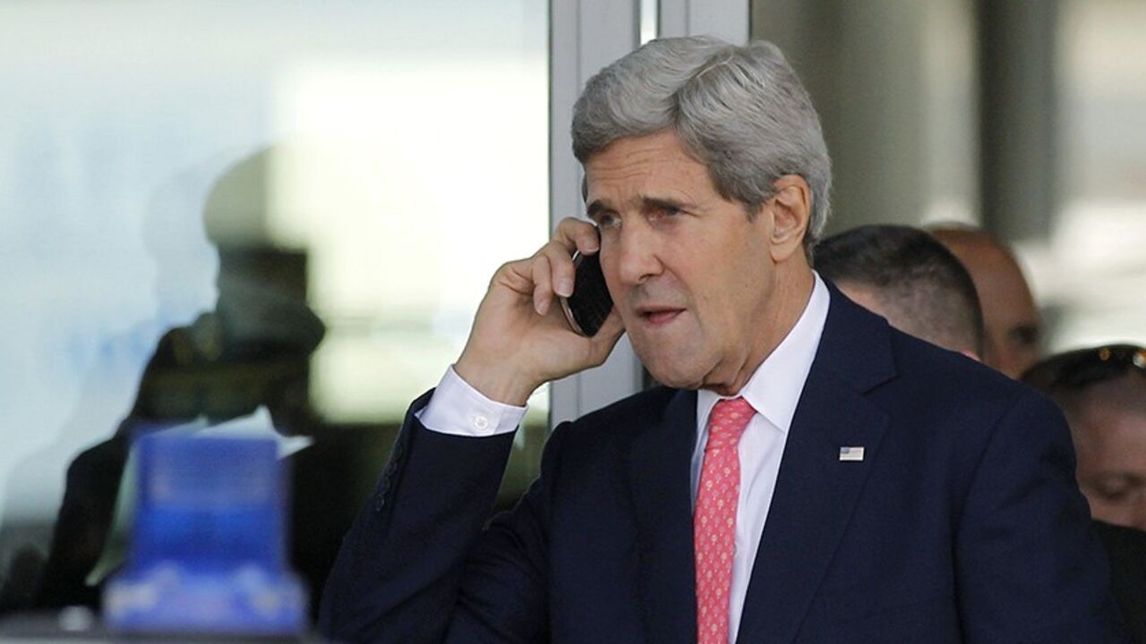 MIDEAST-KERRY/ U.S. Secretary of State John Kerry speaks on a mobile phone after his private meeting with Israeli Prime Minister Benjamin Netanyahu in Tel Aviv November 8, 2013. REUTERS/Jason Reed (ISRAEL - Tags: POLITICS) - RTX1553L