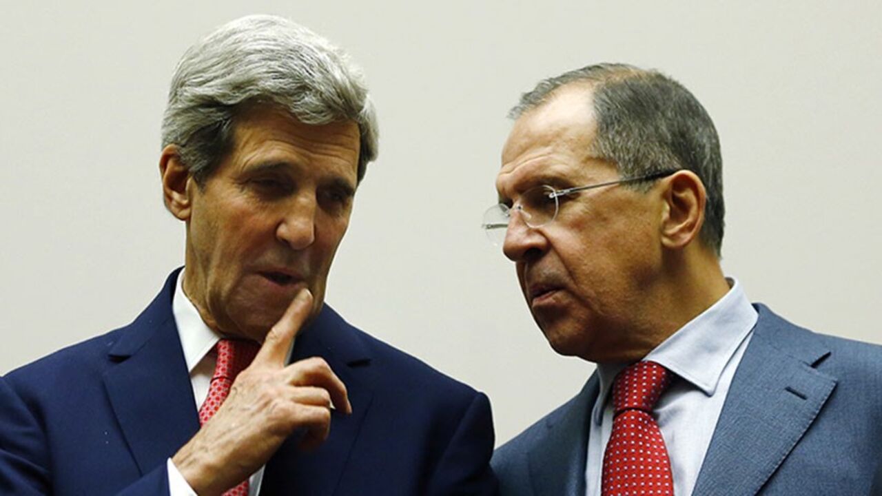 IRAN-NUCLEAR-DEAL/ U.S. Secretary of State John Kerry talks with Russia's Foreign Minister Sergei Lavrov next to French Foreign Minister Laurent Fabius (L-R) during a ceremony at the United Nations in Geneva November 24, 2013. Iran and six world powers reached a breakthrough agreement early on Sunday to curb Tehran's nuclear programme in exchange for limited sanctions relief, in a first step towards resolving a dangerous decade-old standoff. REUTERS/Denis Balibouse (SWITZERLAND - Tags: POLITICS ENERGY) - RTX15QMK