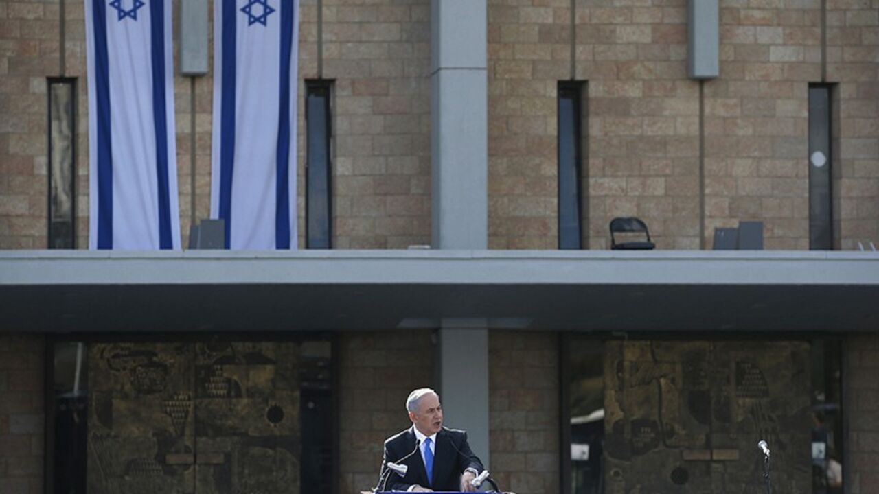 ISRAEL-SHARON/ Israel's Prime Minister Benjamin Netanyahu speaks during a memorial ceremony for former Israeli Prime Minister Ariel Sharon at the Knesset, Israel's parliament, in Jerusalem January 13, 2014. Israel paid homage to Sharon at the first of two funeral services to be held on Monday for a man hailed as a war hero at home but seen by many in the Arab world as a war criminal. REUTERS/Ronen Zvulun (JERUSALEM - Tags: POLITICS OBITUARY) - RTX17C56