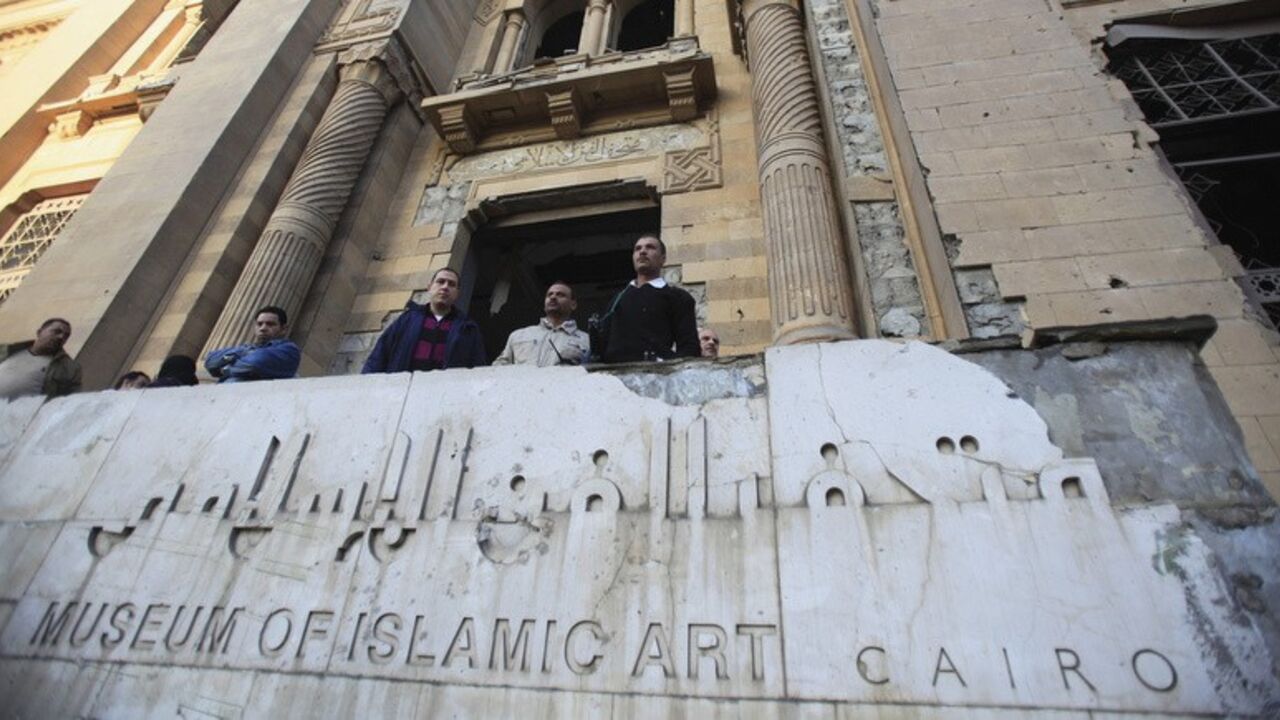 Police officers and people gather in front of damaged Museum of Islamic Art building, after a bomb blast in Cairo Police officers and people gather in front of the damaged Museum of Islamic Art building, after a bomb blast occurred at the nearby Cairo Security Directorate, which includes police and state security, in downtown Cairo, January 24, 2014. A suicide bomber in a car blew himself up in the parking lot of a top security compound in central Cairo on Friday, killing at least four people in one of the most high-profile attacks on the state in months, security sources said. REUTERS/Amr Abdallah Dalsh (EGYPT - Tags