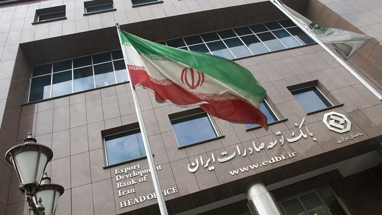 IRAN-BANK/SANCTIONS An Iranian flag flutters in front of the head office of the Export Development Bank of Iran (EDBI) in Tehran November 9, 2008. REUTERS/Morteza Nikoubazl (IRAN) - RTXAEWW