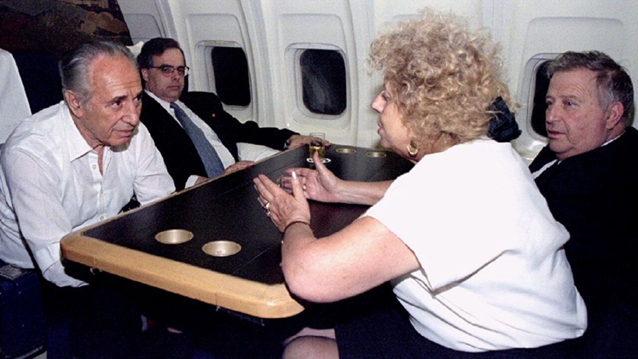 MIDEAST Acting Israeli Prime Minister Shimon Peres (L), listens to his cabinet minister Shulamit Aloni (R), and with Minister Avraham Shohat (R), and senior adviser Uri Savir - RTXFKKT