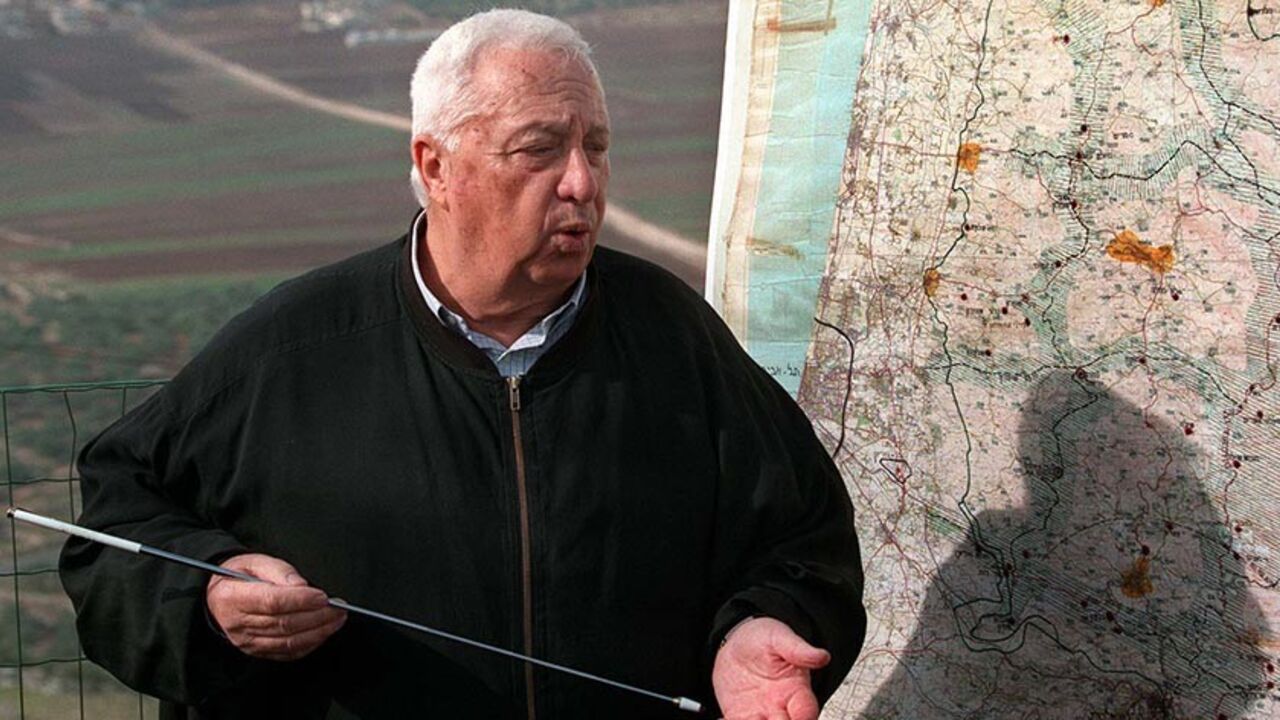 SHARON National Infrastructure Minister Ariel Sharon maps out December 5 his vision of an Israeli security zone stretching deep into the West Bank on land Palestinians see as part of a future state. Sharon spoke while leading members of the Foreign Press Association on a tour of West Bank Jewish settlements. - RTXH39C