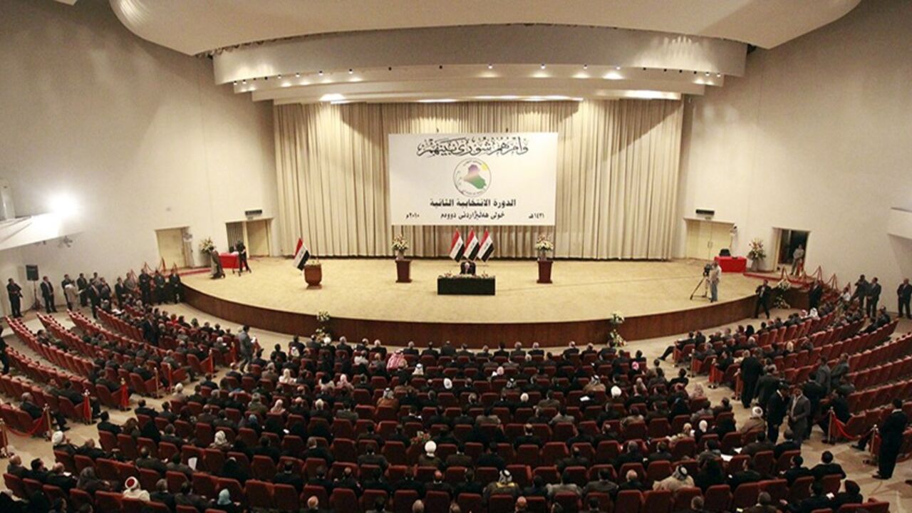 IRAQ/ Members of the new Iraqi Parliament attend a session at the Parliament headquarters in Baghdad, November 11, 2010. Iraq's fractious politicians have agreed to return Shi'ite Nuri al-Maliki as prime minister, ending an eight-month deadlock that raised fears of renewed sectarian war, but leaving some Sunnis sceptical he can forge national unity. The pact on top government posts brings together Shi'ites, Sunnis and Kurds in a power-sharing arrangement similar to the last Iraqi government and could help prevent