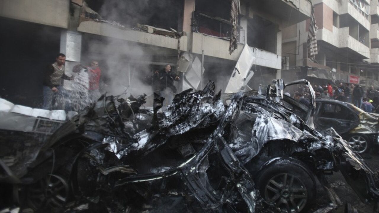 People attempt to extinguish a fire at the site of an explosion in Beirut's southern suburbs People attempt to extinguish a fire at the site of an explosion in Beirut's southern suburbs, January 2, 2014. The powerful explosion in Shi'ite group Hezbollah's southern Beirut stronghold killed three people on Thursday and sent a column of smoke into the sky, a witness said. REUTERS/Khalil Hassan (LEBANON - Tags: POLITICS CIVIL UNREST) - RTX16ZZL