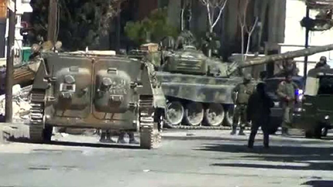 Nic6072351 An image grab from a video uploaded on YouTube shows Syrian army tanks in the city of Yabrud, 80 km north of Damascus on March 8, 2012.
== RESTRICTED TO EDITORIAL USE - MANDATORY CREDIT "AFP PHOTO / YOUTUBE" - NO MARKETING NO ADVERTISING CAMPAIGNS - DISTRIBUTED AS A SERVICE TO CLIENTS - AFP IS USING PICTURES FROM ALTERNATIVE SOURCES AS IT WAS NOT AUTHORISED TO COVER THIS EVENT, THEREFORE IT IS NOT RESPONSIBLE FOR ANY DIGITAL ALTERATIONS TO THE PICTURE'S EDITORIAL CONTENT, DATE AND LOCATION WHICH CANNOT BE