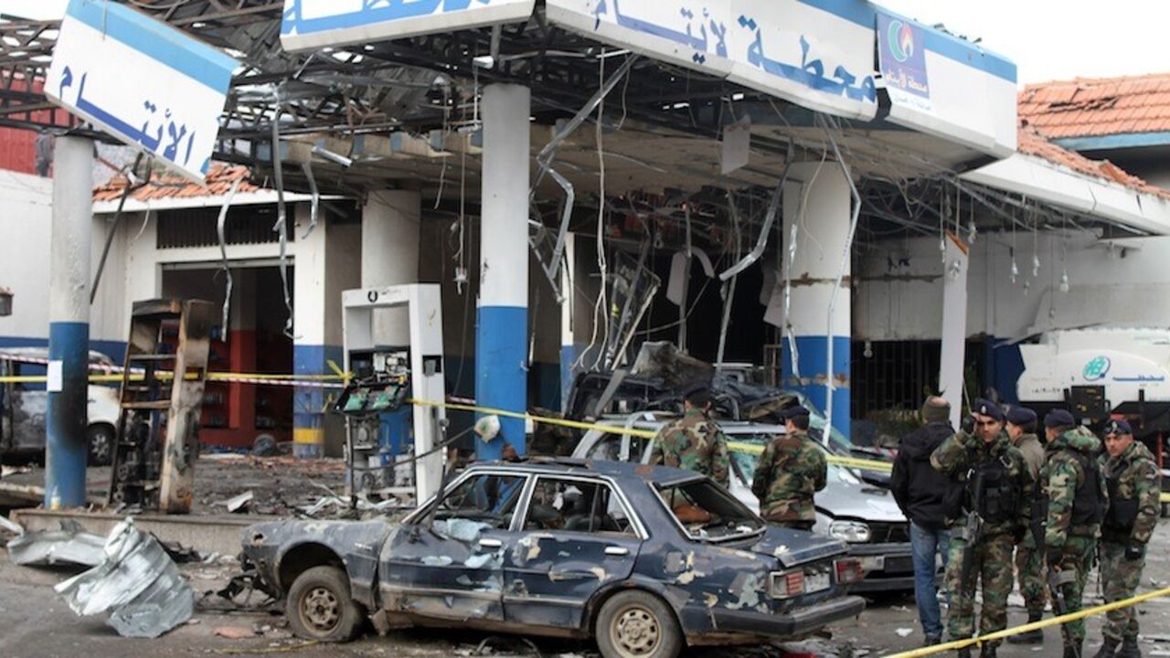 Lebanese army soldiers stand guard at the site of a car bomb, that targeted Al-Aytam service station the day before and left at least four people dead, in the town of Hermel, in Lebanon's eastern Bekaa valley, on February 2, 2014. The Al-Nusra Front in Lebanon, a group named after Al-Qaeda's Syrian affiliate, claimed the attack on Twitter, saying it was a suicide bombing in response to Hezbollah's involvement in Syria. AFP PHOTO/STR        (Photo credit should read -/AFP/Getty Images)