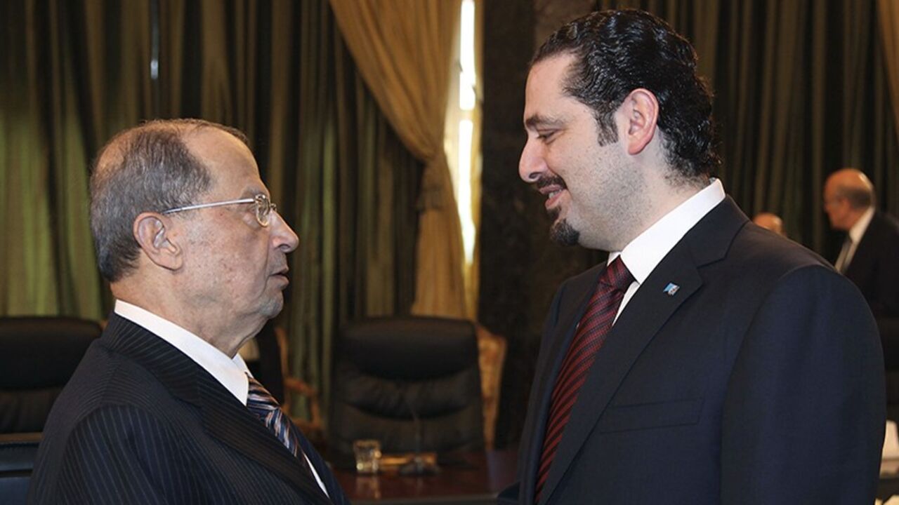 LEBANON/ Lebanon's Prime Minister Saad al-Hariri (R) shakes hands with Lebanese Christian leader and head of the Free Patriotic Movement Michel Aoun during the eighth session of the national dialogue between political leaders at the Presidential Palace in Baabda, near Beirut March 9, 2010. REUTERS/Dalati Nohra/Handout (LEBANON - Tags: POLITICS RELIGION) FOR EDITORIAL USE ONLY. NOT FOR SALE FOR MARKETING OR ADVERTISING CAMPAIGNS - RTR2BEYN