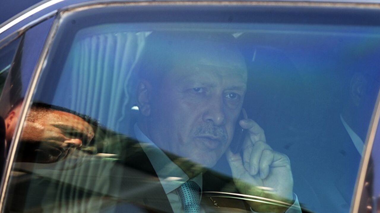 MACEDONIA-TUREKEY Turkey's Prime Minister Tayyip Erdogan speaks on the phone in his car during his visit to Skopje September 29, 2011. Turkey's Prime Minister Erdogan is on a two-day official visit to Macedonia. REUTERS/Ognen Teofilovski (MACEDONIA - Tags: POLITICS) - RTR2RZV9