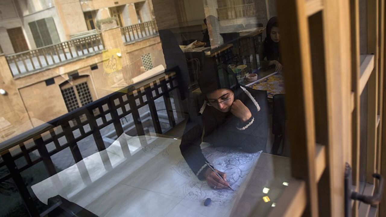 IRAN/ EDITORS' NOTE: Reuters and other foreign media are subject to Iranian restrictions on leaving the office to report, film or take pictures in Tehran.
A student draws a pattern for a Persian handmade carpet as she sits in a classroom in Isfahan Art University, 450 km (280 miles) south of Tehran November 14, 2011. Persian carpet weaving is a historical part of Iranian culture, dating back to as far as approximately 2,000 years ago. Persian carpets can be mostly divided into three size groups: large (3x4 metre