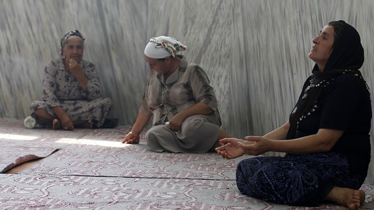 SYRIA-CRISIS/TURKEY-ALAWITE Turkish Alawite women pray in a tomb, a holy site to the Alawite community, in the Samandag district of Hatay province, close to the border with Syria, July 27, 2012. An influx of Syrians fleeing President Bashar al-Assad's military onslaught is stoking tension in the area of Turkey known for religious tolerance and setting Turks who share the Syrian leader's creed against their own government. In the Turkish frontier province of Hatay, home to the Antioch of the Bible and a mix of confessional groups rare