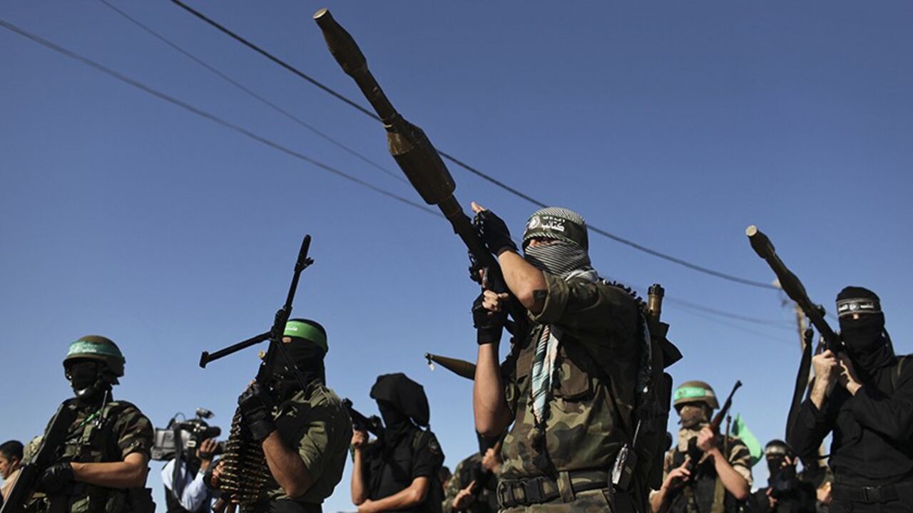 PALESTINIANS-HAMAS/CHIEF Palestinian members of the al-Qassam brigades, the armed wing of the Hamas movement, stand guard as they wait for the arrival of Hamas chief Khaled Meshaal in Rafah in the southern Gaza Strip December 7, 2012. Meshaal, Hamas's exiled leader, will step onto Palestinian land for the first time in 45 years on Friday for a "victory rally" in the Gaza Strip, displaying his newfound confidence after last month's conflict with Israel. Meshaal, the Islamist group's leader, who has not visited the Palestinian Territ