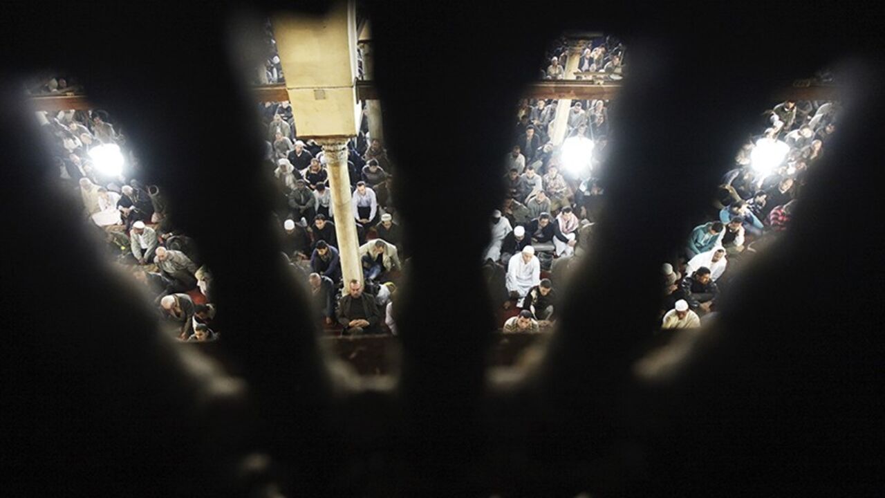 EGYPT People listen to a speech by Egyptian Cleric Sheikh Yusuf al-Qaradawi, chairman of the International Union of Muslim Scholars, during Friday prayers before a protest against Syrian President Bashar al-Assad at Al Azhar mosque in old Cairo December 28, 2012. REUTERS/Amr Abdallah Dalsh (EGYPT - Tags: POLITICS CIVIL UNREST RELIGION) - RTR3BY3B