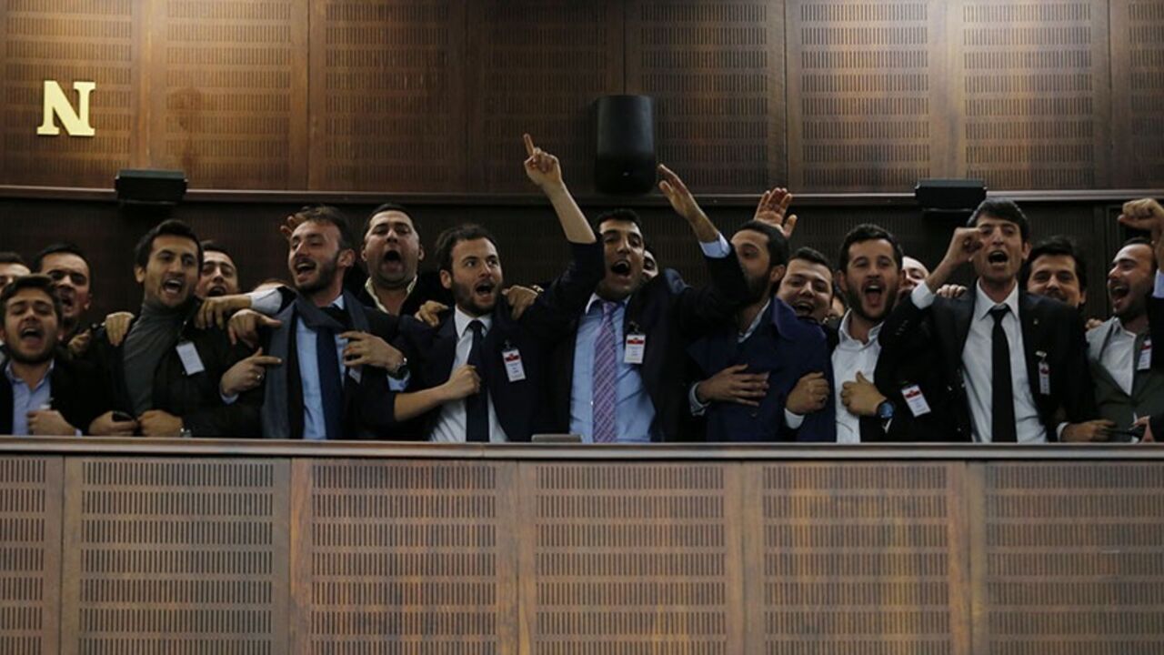 TURKEY-ERDOGAN/RECORDINGS Supporters of Turkey's Prime Minister Tayyip Erdogan react as he addresses the audience during a meeting at the Turkish parliament in Ankara February 25, 2014. Erdogan said on Tuesday voice recordings purportedly of him telling his son to dispose of large sums of money on the day news broke of a graft inquiry were a "treacherous attack" on his office. In a speech to his ruling AK Party deputies in parliament, Erdogan also said the recordings, which appeared on YouTube late on Monday, were a "shameless monta