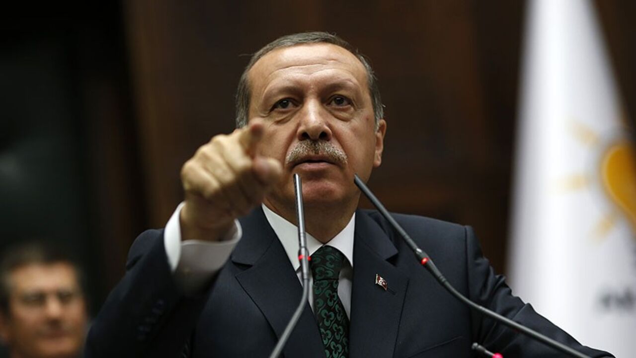 TURKEY-PROTESTS/ Turkey's Prime Minister Tayyip Erdogan addresses members of parliament from his ruling AK Party (AKP) during a meeting at the Turkish parliament in Ankara June 25, 2013. Turkish anti-terrorism police detained 20 people in raids in the capital Ankara on Tuesday in connection with weeks of anti-government protests across the country, media reports said. The unrest began at the end of May when police used force against campaigners opposed to plans to redevelop a central Istanbul park. The protest spiralled int