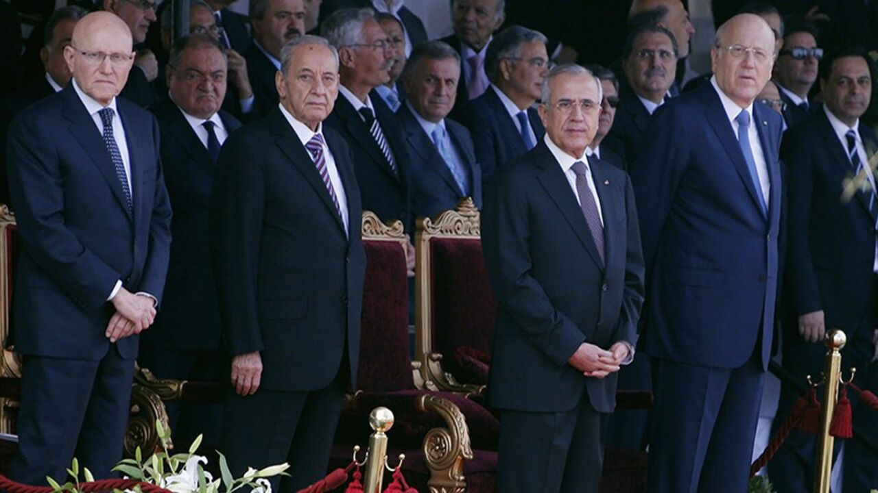 LEBANON/ (From L to R) Lebanon's Prime Minister-designate Tammam Salam, parliamentary speaker Nabih Berri, Lebanon's President Michel Suleiman and caretaker Prime Minister Najib Mikati attend a military parade to celebrate the 70th anniversary of Lebanon's independence in downtown Beirut November 22, 2013. REUTERS/Mohamed Azakir (LEBANON - Tags: ANNIVERSARY POLITICS MILITARY) - RTX15OH8