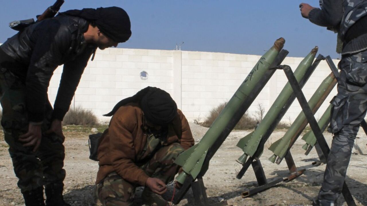 Fighters from the Free Syrian Army's Saif al-Umayyad brigade prepare rockets to be launched towards forces loyal to Syria's President Assad in Ghouta Fighters from the Free Syrian Army's Saif al-Umayyad brigade prepare rockets to be launched towards forces loyal to Syria's President Bashar al-Assad in the eastern Damascus suburb of Ghouta January 16, 2014. Picture taken January 16, 2014. REUTERS/Rafat Beram (SYRIA - Tags: CIVIL UNREST CONFLICT) - RTX17I18