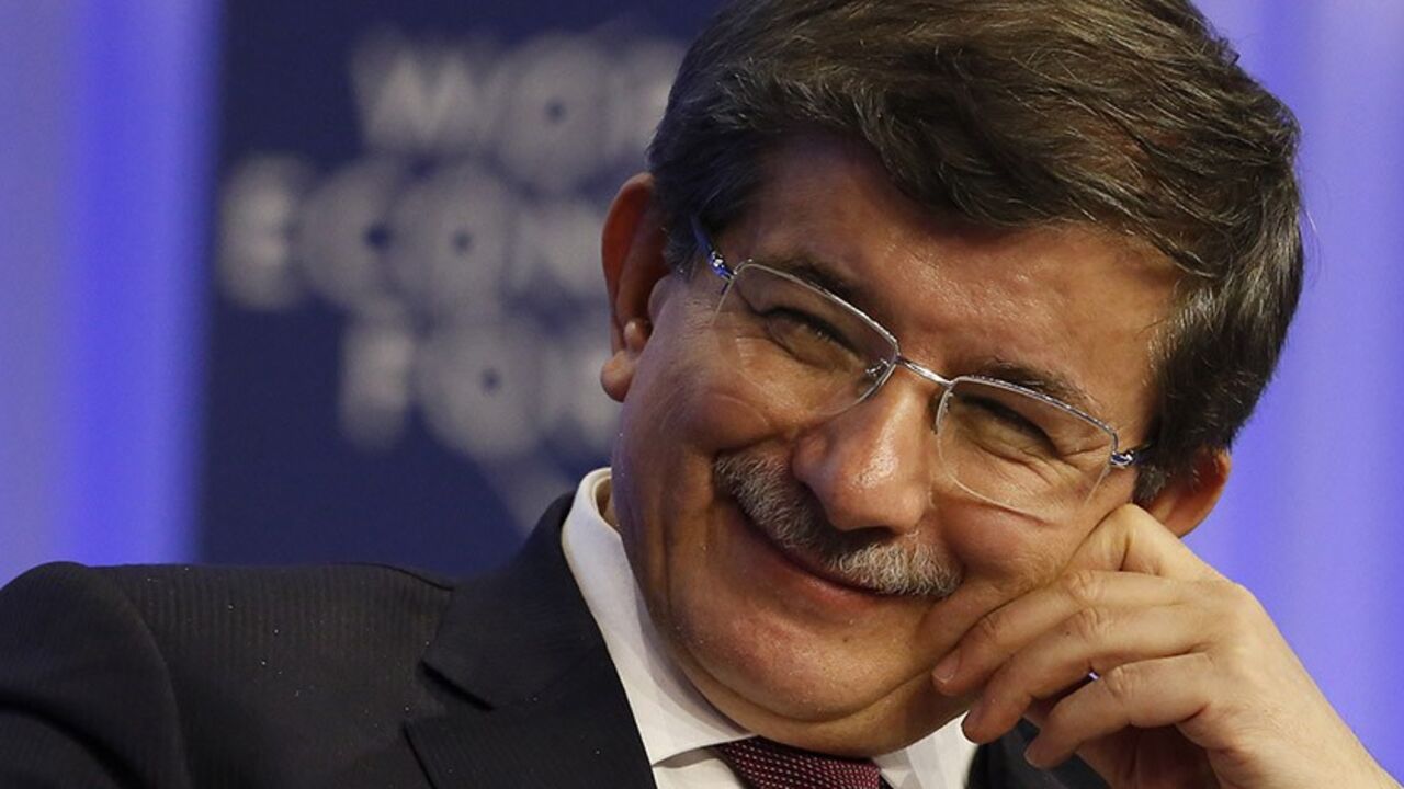 DAVOS/ Turkish Foreign Minister Ahmet Davutoglu attends a session at the annual meeting of the World Economic Forum (WEF) in Davos January 24, 2014. REUTERS/Ruben Sprich (SWITZERLAND - Tags: POLITICS BUSINESS) - RTX17SM8