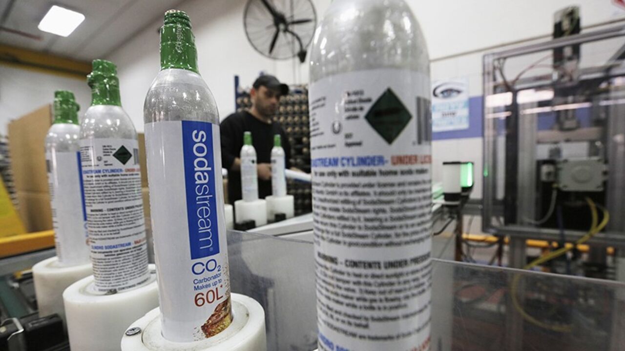 ISRAEL-PALESTINIANS/SCARLETTJOHANSSON Carbonator bottles are seen at the SodaStream factory in the West Bank Jewish settlement of Maale Adumim January 28, 2014. Appliance maker SodaStream International Ltd scored big in nabbing A-list actress Scarlett Johansson as its global brand ambassador in time for this year's Super Bowl advertising bonanza. But the limelight can be harsh. While the multi-million dollar deal may have increased brand awareness, it also strengthened calls for a boycott of the Israel-based company, whose main factory lies in