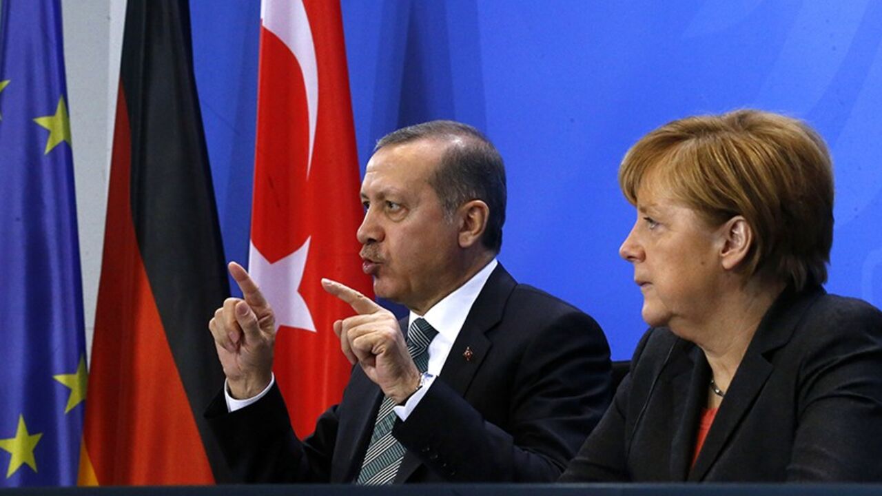 GERMANY German Chancellor Angela Merkel and Turkey's Prime Minister Tayyip Erdogan address the media after talks in Berlin February 4, 2014. REUTERS/Tobias Schwarz (GERMANY - Tags: POLITICS) - RTX187HH