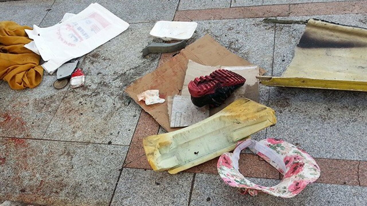 EGYPT-BLAST/ A shoe is seen on a pavement covered with blood in the Red Sea resort town of Taba in the south Sinai, February 16, 2014. An explosion on a tourist bus in Egypt's Sinai peninsula killed three Koreans and the Egyptian driver on Sunday, the Interior Ministry said, an apparent turning point in an Islamist insurgency that has gained pace since an army takeover in July. REUTERS/Stringer (EGYPT - Tags: POLITICS CIVIL UNREST) - RTX18XQD