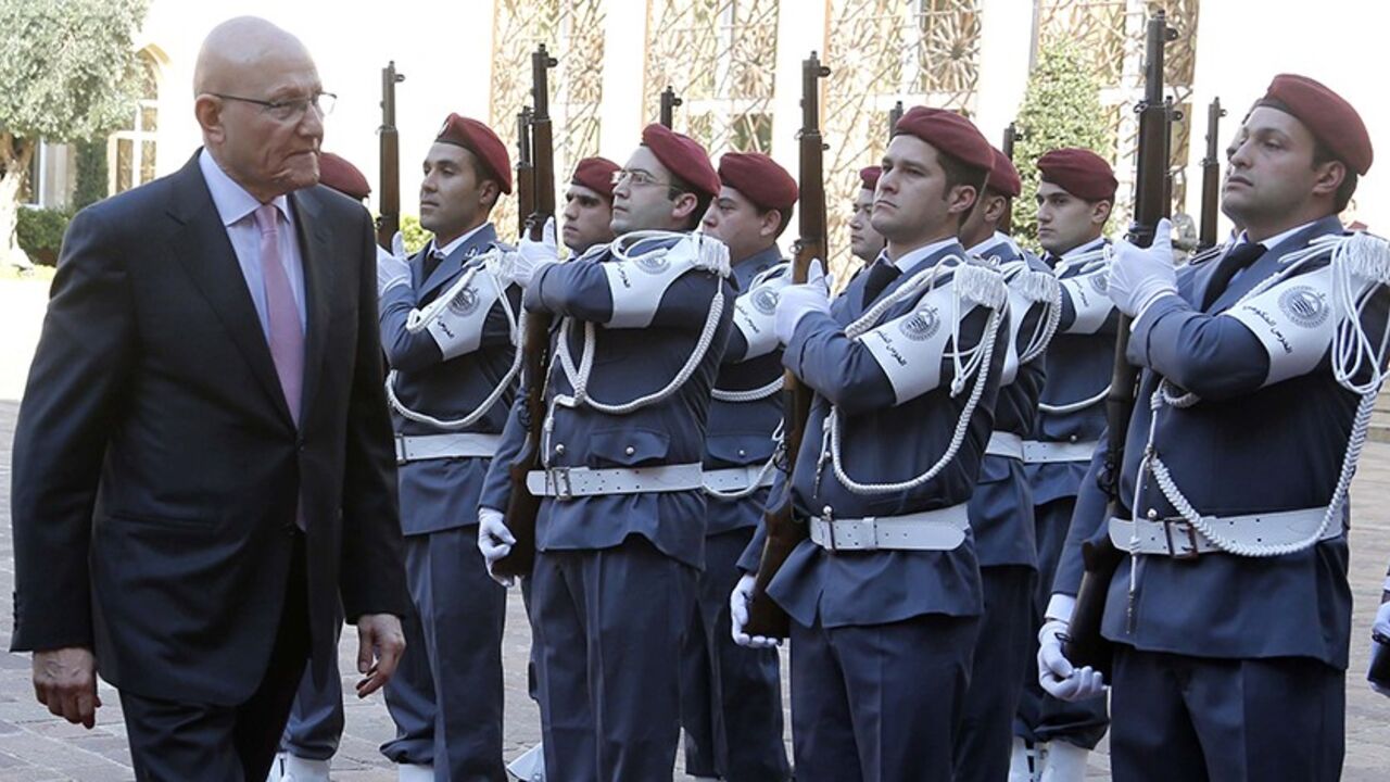 LEBANON-GOVERNMENT/ Lebanon's Prime Minister Tammam Salam reviews an honour guard during an official ceremony at the governmental palace to mark his assumption of duties as the new premier February 17, 2014. Lebanon announced a new government on Saturday, breaking a 10-month political deadlock during which spillover violence from neighbouring Syria worsened internal instability. REUTERS/Mohamed Azakir (LEBANON - Tags: POLITICS) - RTX18YZB