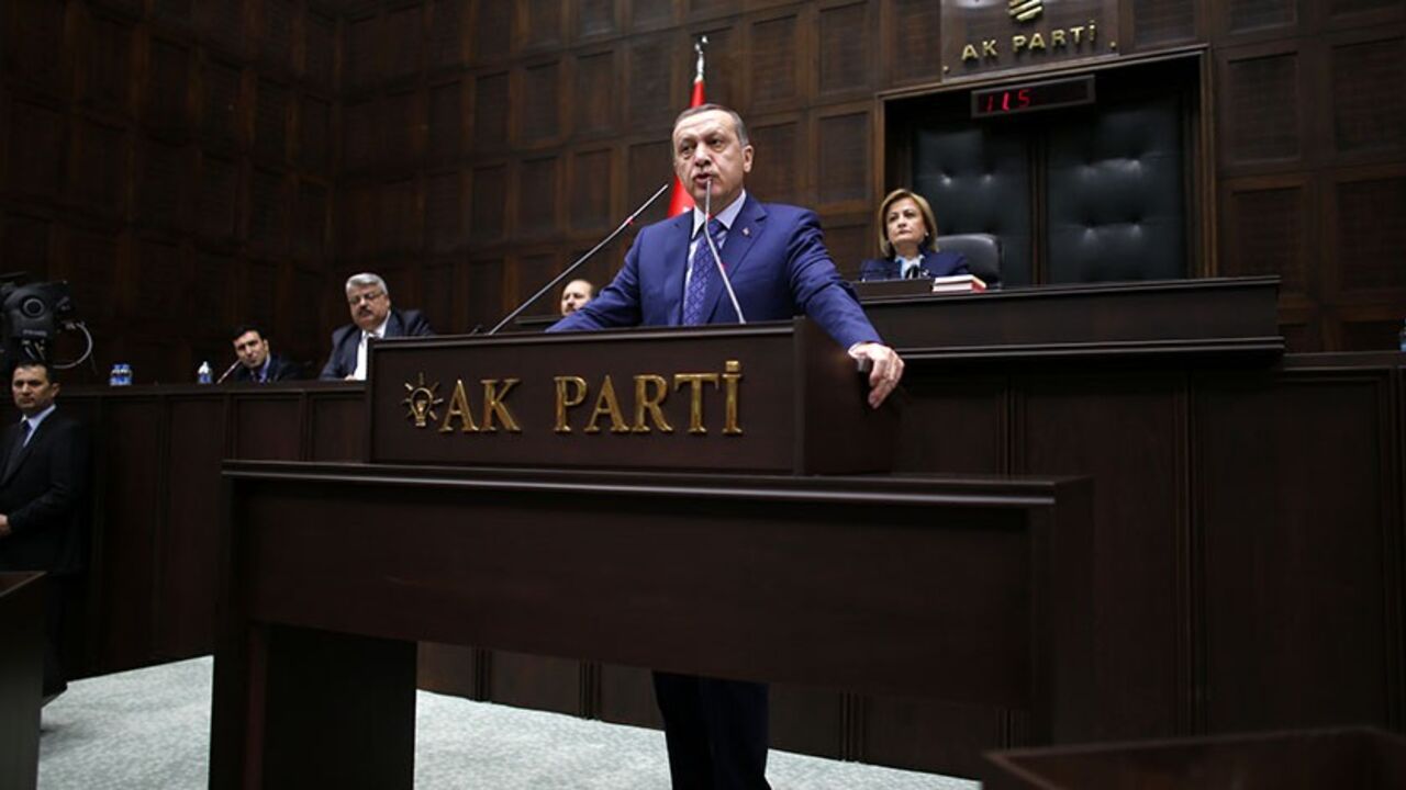 TURKEY-ERDOGAN/ Turkey's Prime Minister Tayyip Erdogan addresses members of parliament from his ruling AK Party (AKP) during a meeting at the Turkish parliament in Ankara February 18, 2014. REUTERS/Umit Bektas (TURKEY - Tags: POLITICS TPX IMAGES OF THE DAY) - RTX1915M