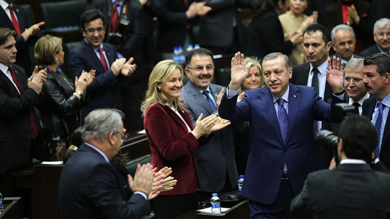 TURKEY-ERDOGAN/ Turkey's Prime Minister Tayyip Erdogan greets his supporters as he arrives at a meeting at the Turkish parliament in Ankara February 18, 2014. REUTERS/Umit Bektas (TURKEY - Tags: POLITICS) - RTX1916P