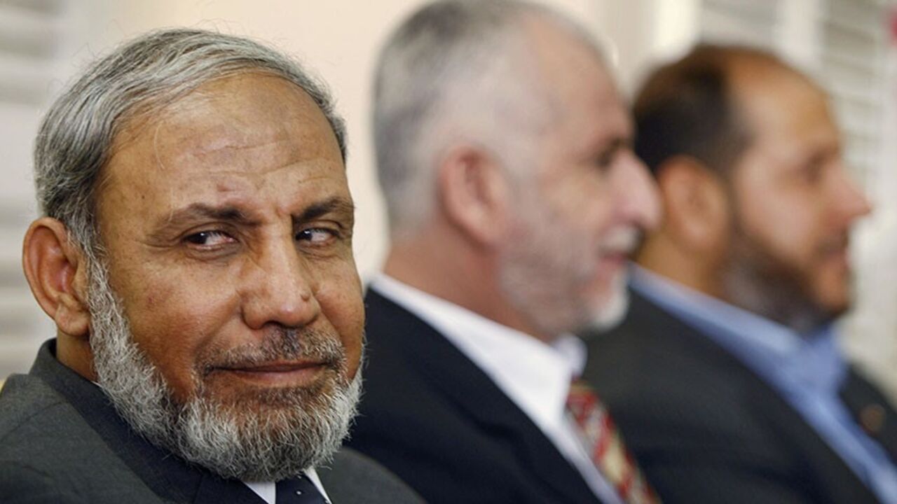 Senior Hamas leaders Mahmoud al-Zahar (L), Saeed Seyam (C) and Khalil al-Hayya wait at the Rafah border crossing in the southern Gaza Strip before crossing into Egypt October 7, 2008. Hamas leaders will hold talks in Cairo on Wednesday on proposals to end the schism with Palestinian President Mahmoud Abbas's Fatah group by reshaping the way the Hamas-controlled Gaza Strip is governed.
REUTERS/Ibraheem Abu Mustafa (GAZA) - RTX9AWH