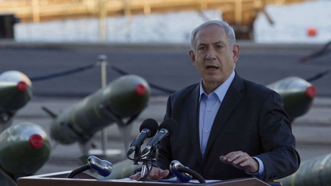 Israel's Prime Minister Netanyahu speaks to the media in front of a display of M302 rockets at a navy base in Eilat Israel's Prime Minister Benjamin Netanyahu speaks to the media in front of a display of M302 rockets, found aboard the Klos C ship, at a navy base in the Red Sea resort city of Eilat March 10, 2014. Netanyahu, displaying on Monday what Israel said were seized Iranian-supplied missiles bound for militants in Gaza, called on the West not to be fooled by Tehran's diplomatic outreach over its nuclear programme. REUTERS/Amir Cohen (ISRAEL - Tags: POLITICS MILITARY CIVIL UNREST) - RTR3GGS8