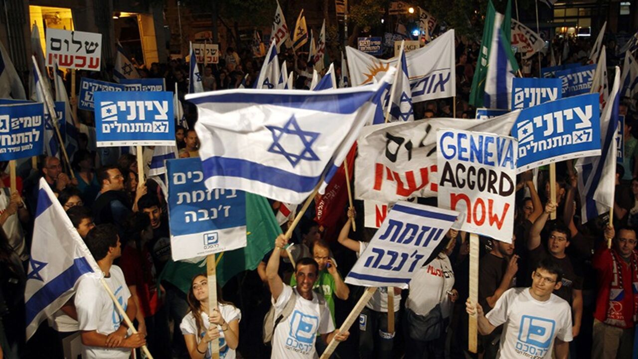 PALESTINIANS-ISRAEL/LEFT Left-wing Israeli activists take part in a rally in Jerusalem in this May 15, 2010 file photo. The weekend rally in Jerusalem by Israelis demanding an end to their country's settlement and occupation of the West Bank was hailed by its left-wing sponsors as the start of a major push that could help U.S. peace efforts. Photo taken May 15, 2010. REUTERS/Ronen Zvulun/Files (JERUSALEM - Tags: CIVIL UNREST POLITICS) - RTR2DYLU