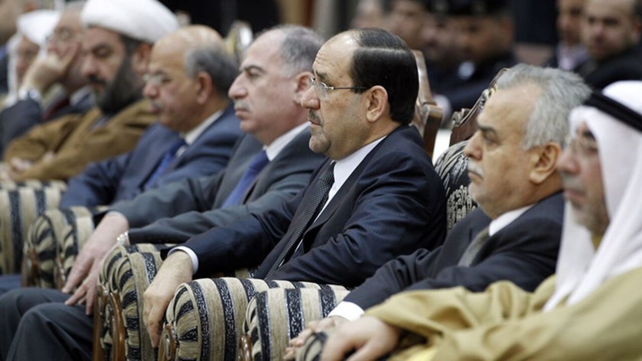 Iraq's parliament speaker Osama al-Nujaifi, Prime Minister Nuri al-Maliki, Iraq's Vice President Tareq al-Hashimi and Head of the Sunni Endowment Ahmed Abdul-Ghafoor al-Samarraie (4th R-R) attend a ceremony to mark the birth anniversary of Prophet Mohammed at Um al-Qura mosque in Baghdad February 15, 2011. REUTERS/Mohammed Ameen (IRAQ - Tags: POLITICS RELIGION) - RTR2IMJK
