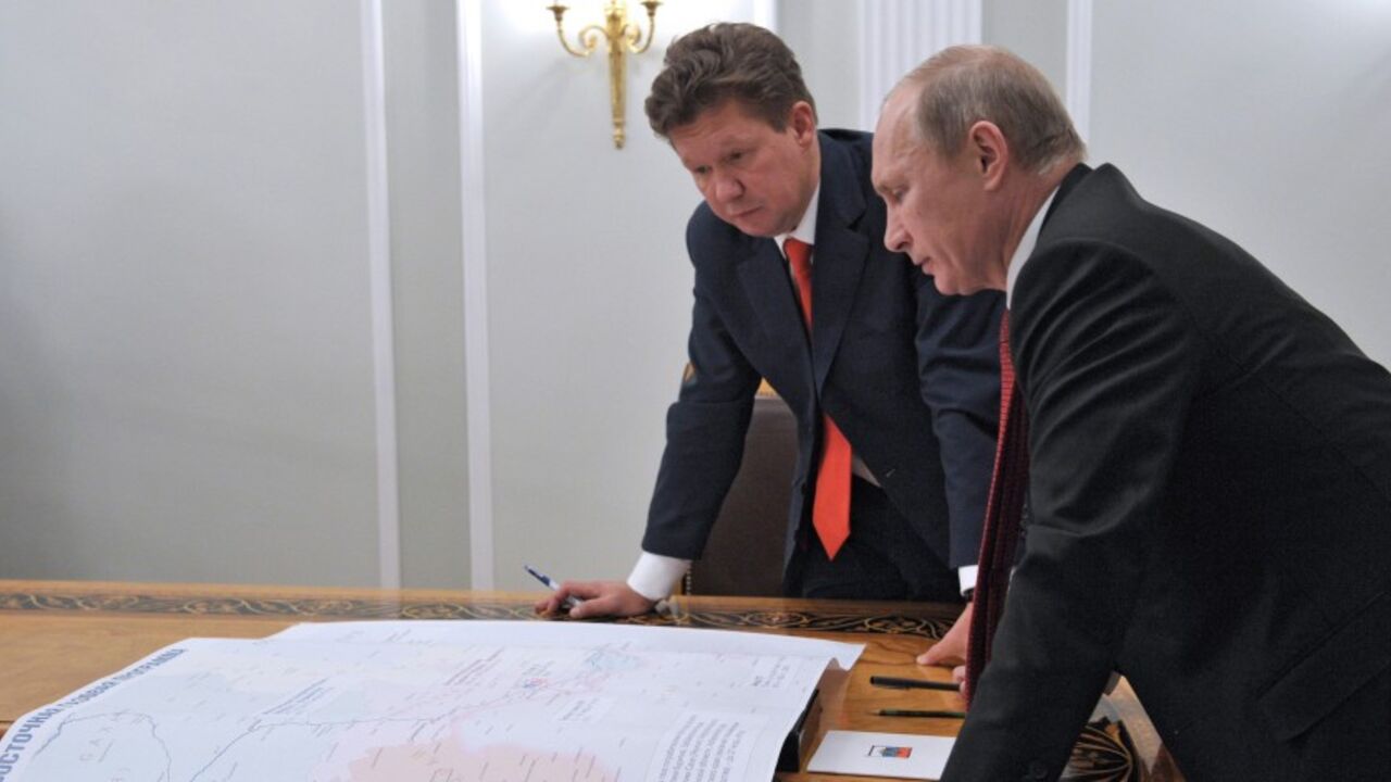 GAZPROM-VLADIVOSTOK/ Russia's President Vladimir Putin (R) meets with Gazprom's Chief Executive Alexei Miller at the Novo-Ogaryovo residence outside Moscow, October 29, 2012. Russia's Gazprom pledged more than $38 billion (23.7 billion pounds) to develop an East Siberian gas field and build a pipeline to the Pacific port of Vladivostok to lessen its reliance on exports to Europe and develop Asian markets. REUTERS/Aleksey Nikolskyi/RIA Novosti/Pool (RUSSIA - Tags: POLITICS ENERGY BUSINESS) THIS IMAGE HAS BEEN SUPPLIED BY A THIRD