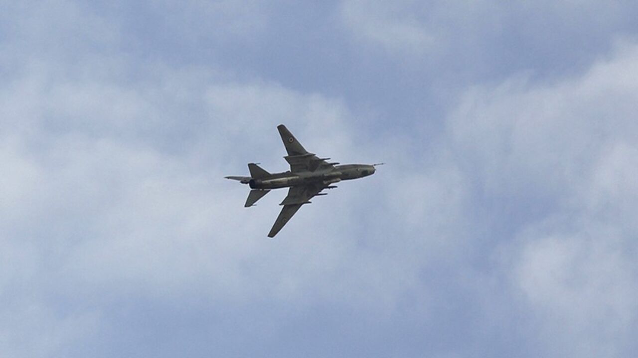 SYRIA-CRISIS/TURKEY-JET A Syrian Air Force fighter plane flies over the Syrian town of Ras al-Ain during an air strike, as seen from the Turkish border town of Ceylanpinar, Sanliurfa province November 13, 2012. A Syrian warplane struck homes in the town of Ras al-Ain on Tuesday within sight of the Turkish border, pursuing an aerial bombardment to force out rebels and drawing a new warning from Ankara. The second day of jet strikes sent Syrians scurrying through the flimsy barbed-wire fence that divides Ras al-Ain from the Turkish