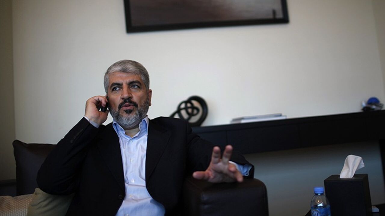 PALESTINIANS-MESHAAL/ Hamas leader Khaled Meshaal uses his mobile phone in his office in Doha November 29, 2012. Meshaal said the de facto recognition of a sovereign Palestinian state won by his rival Mahmoud Abbas should be seen alongside Gaza's latest conflict with Israel as a single, bold strategy that could empower all Palestinians. Meshaal said the short war which claimed 162 Palestinian lives and five Israelis was concluded on terms set by the Palestinian Islamist movement and ended its isolation, creating a new mood that